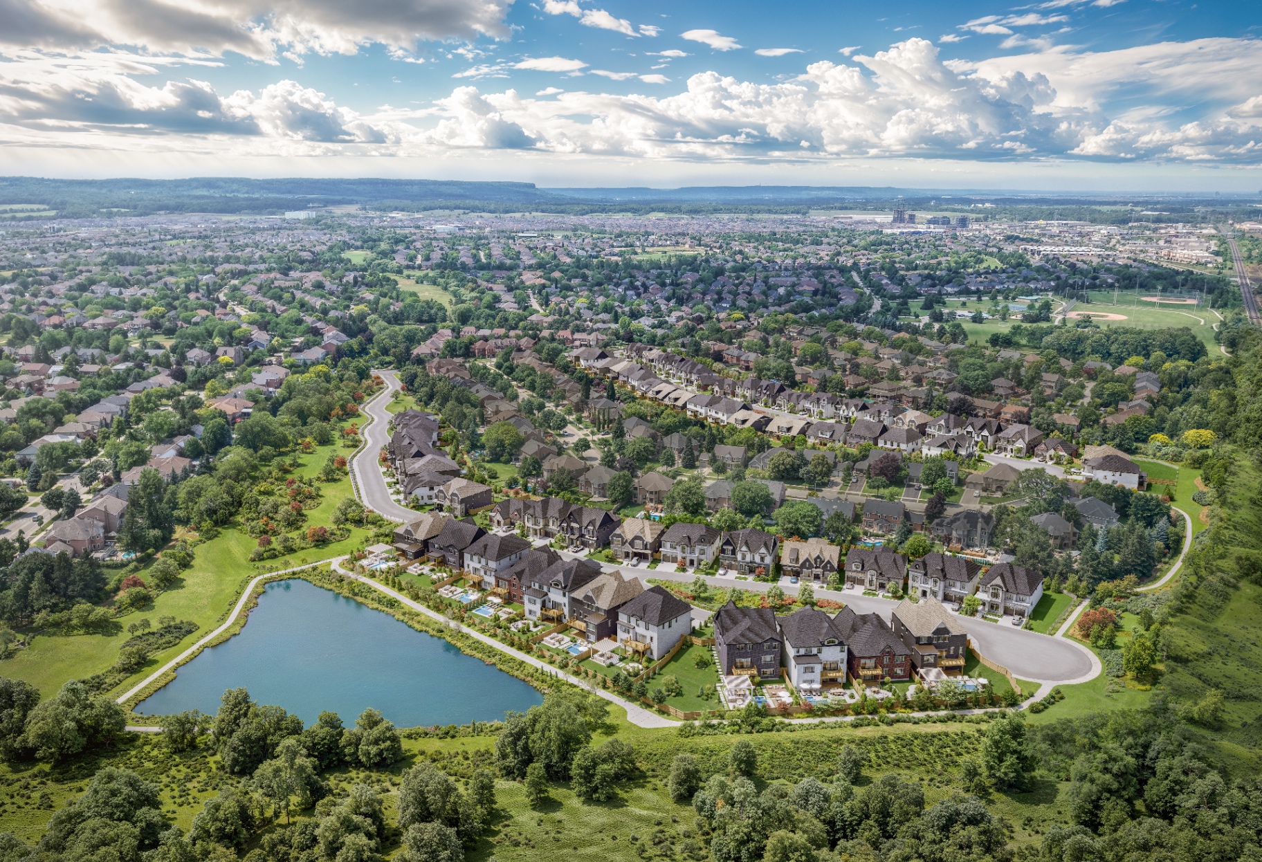 Aerial view of Millcroft Legacy community and pond